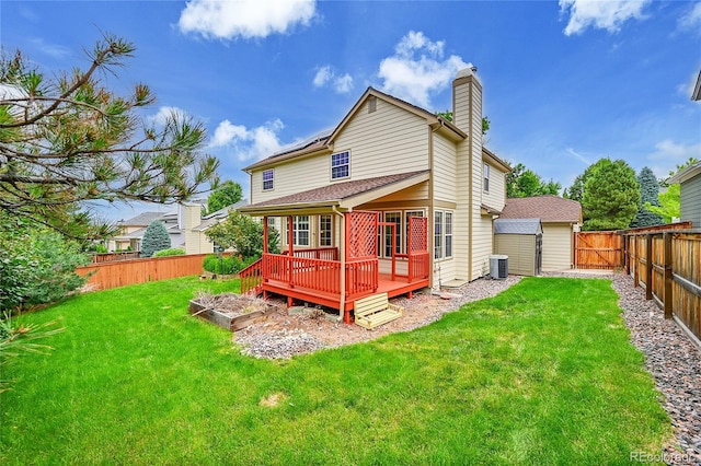 2316 Weatherstone Cir, Highlands Ranch, CO 80126 - back of property featuring a fenced backyard, a chimney, and a wooden deck