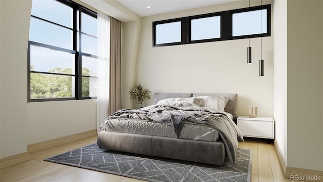 bedroom with light wood-type flooring