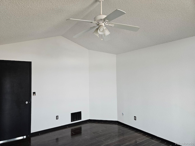 unfurnished room featuring ceiling fan, a textured ceiling, dark hardwood / wood-style flooring, and lofted ceiling