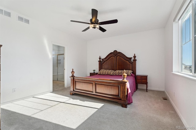 carpeted bedroom featuring a ceiling fan, baseboards, and visible vents