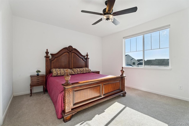 carpeted bedroom with baseboards and ceiling fan