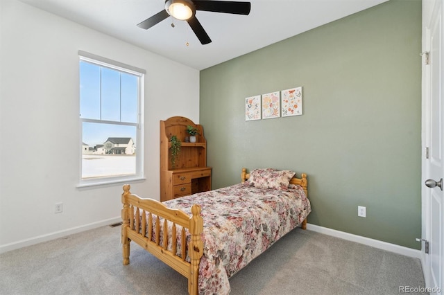 bedroom featuring baseboards, carpet, and a ceiling fan