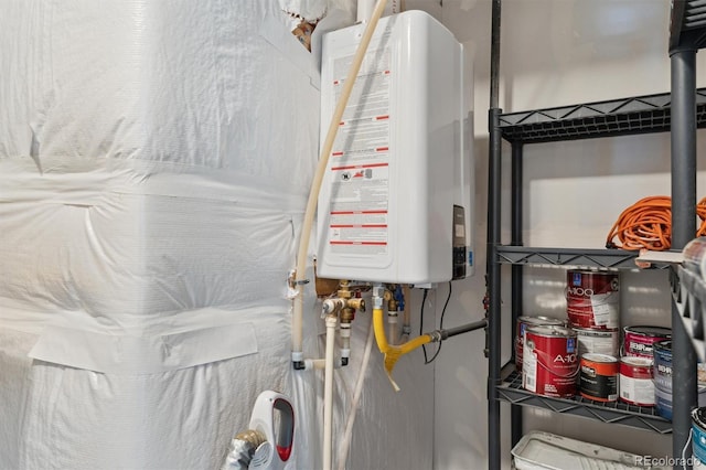 utility room with tankless water heater