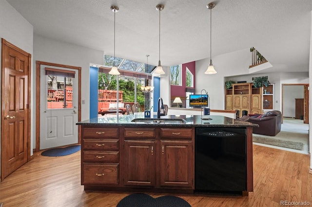 5723 S Everett Way, Littleton, CO 80123 - kitchen with dishwasher, a sink, light wood-style floors, open floor plan, and a center island with sink