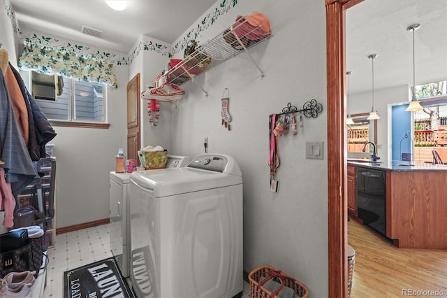 5723 S Everett Way, Littleton, CO 80123 - laundry room featuring independent washer and dryer and light floors
