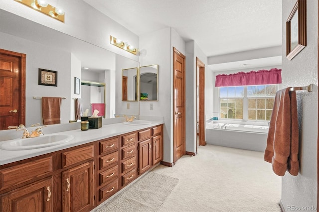 5723 S Everett Way, Littleton, CO 80123 - bathroom with double vanity, a garden tub, baseboards, and a shower with door