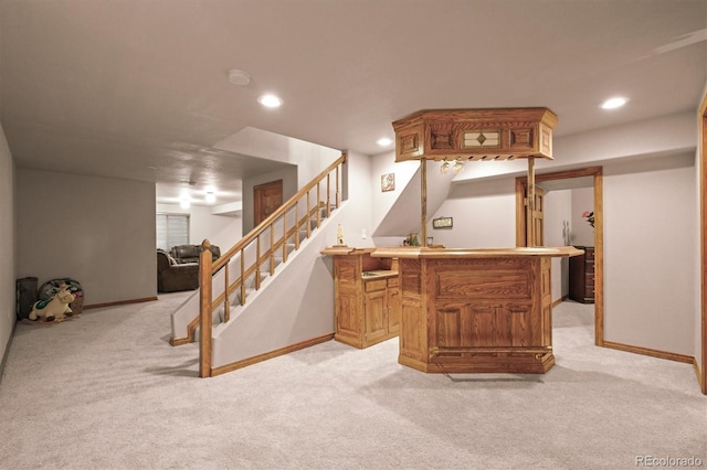 5723 S Everett Way, Littleton, CO 80123 - indoor dry bar with light colored carpet, stairs, baseboards, and recessed lighting