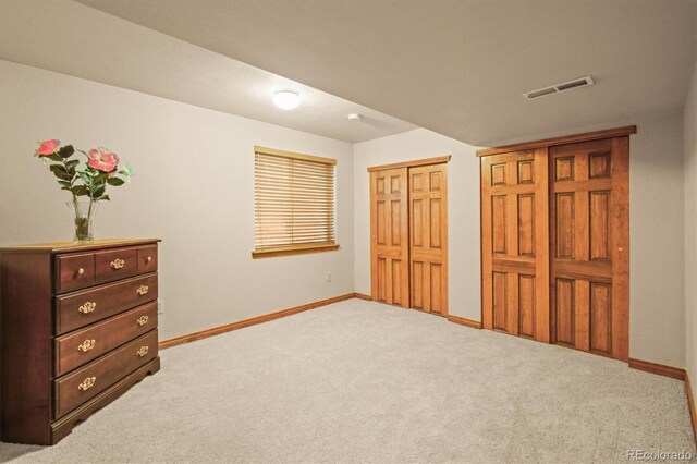 5723 S Everett Way, Littleton, CO 80123 - carpeted bedroom featuring baseboards and multiple closets