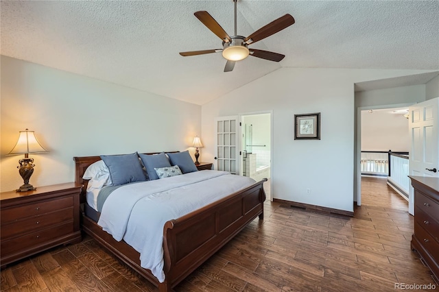 bedroom with ceiling fan, lofted ceiling, dark wood-type flooring, and a textured ceiling