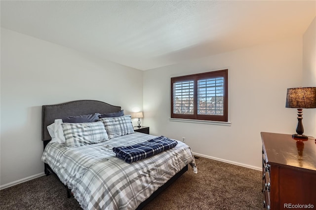 bedroom featuring dark colored carpet