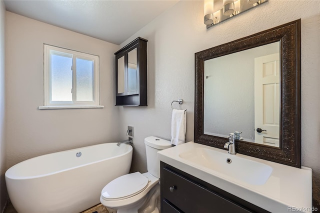 bathroom with a tub to relax in, toilet, and vanity