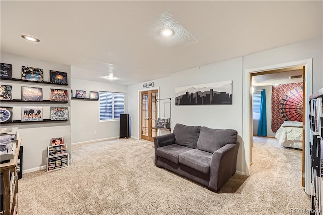 carpeted living room with french doors