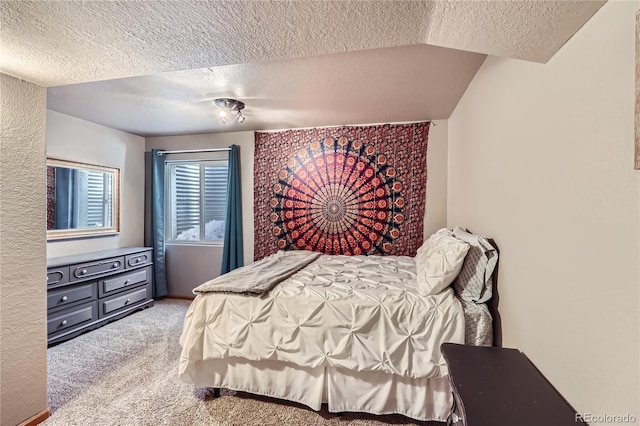 carpeted bedroom featuring a textured ceiling