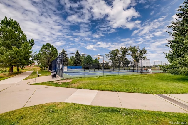 view of sport court featuring a yard and tennis court