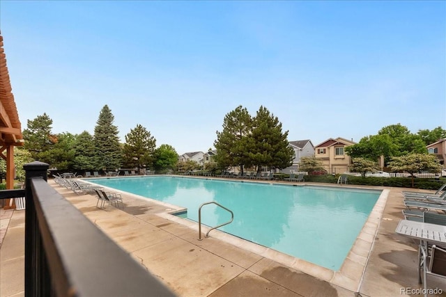 1241 S Akron Way, Denver, CO 80247 - community pool with a patio area