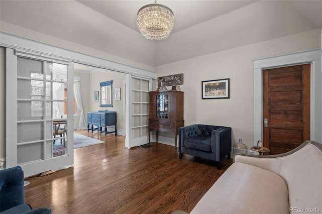5675 S Crocker St, Littleton, CO 80120 - living area with a chandelier, dark wood-style floors, and baseboards