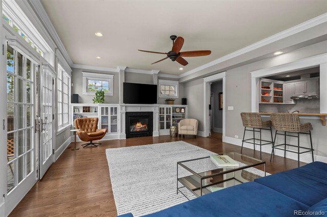 5675 S Crocker St, Littleton, CO 80120 - living room with a ceiling fan, ornamental molding, a glass covered fireplace, wood finished floors, and recessed lighting