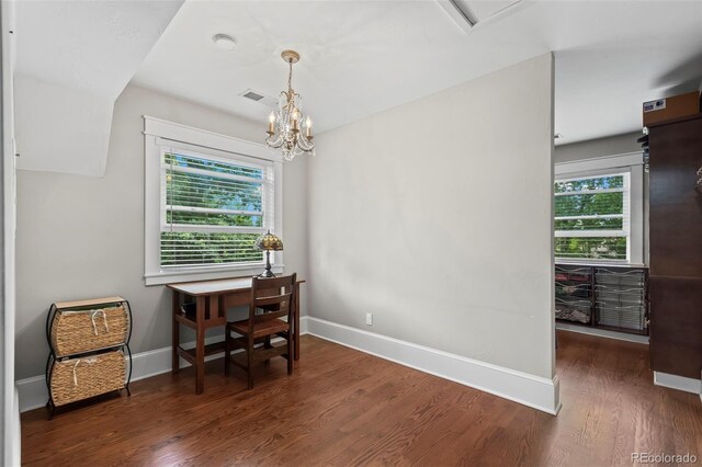 5675 S Crocker St, Littleton, CO 80120 - office space featuring wood finished floors, baseboards, and a chandelier