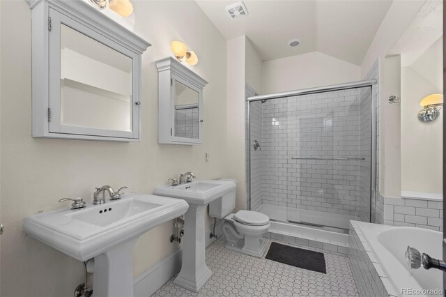 5675 S Crocker St, Littleton, CO 80120 - bathroom with a shower stall, toilet, a relaxing tiled tub, vaulted ceiling, and tile patterned floors