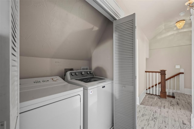 5675 S Crocker St, Littleton, CO 80120 - laundry area with independent washer and dryer, light wood finished floors, and baseboards