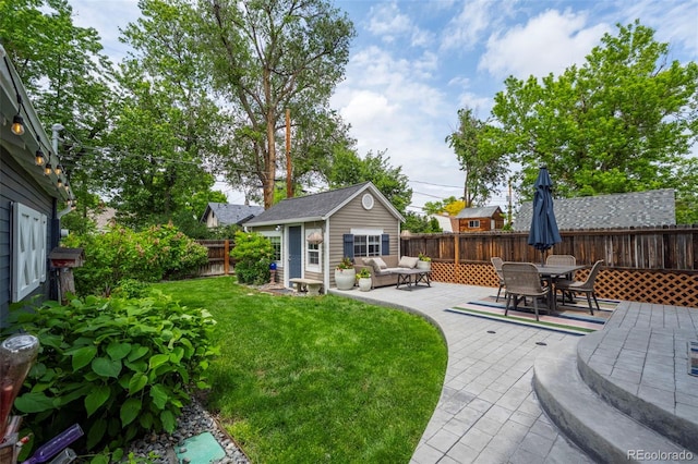 5675 S Crocker St, Littleton, CO 80120 - view of yard featuring an outdoor structure, a patio area, and outdoor dining space