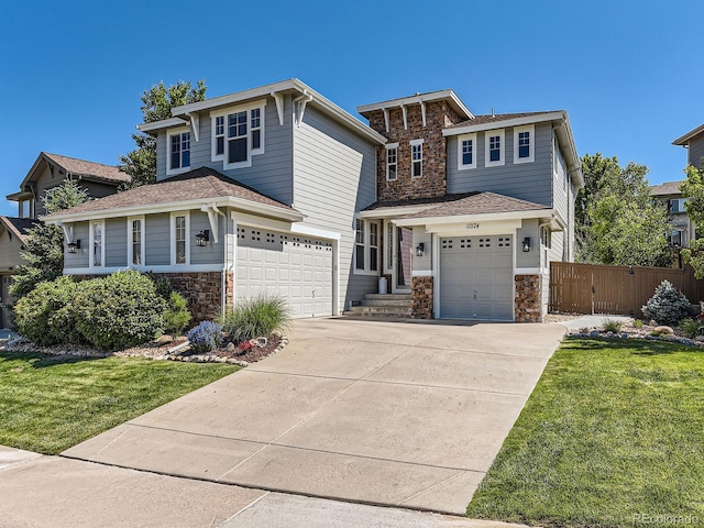 11074 Grayledge Cir, Highlands Ranch, CO 80130 - view of front of property featuring stone siding, a garage, driveway, and a shingled roof