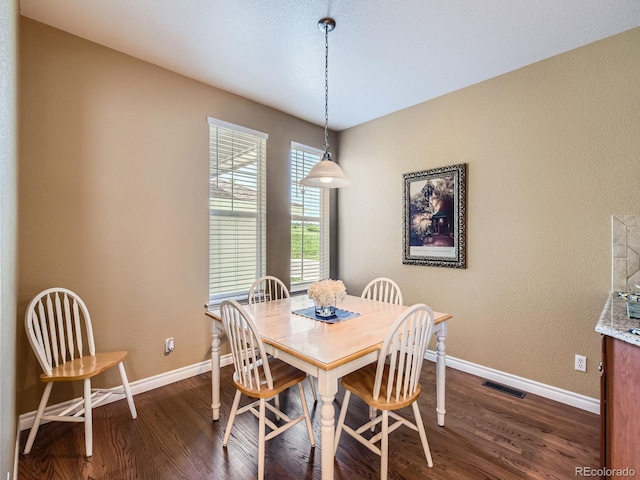 11074 Grayledge Cir, Highlands Ranch, CO 80130 - dining room with dark wood-style floors