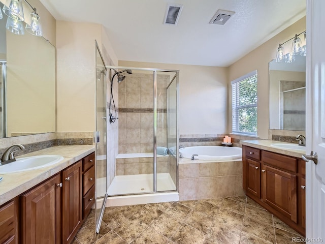 11074 Grayledge Cir, Highlands Ranch, CO 80130 - bathroom with two vanities, a shower stall, and a garden tub