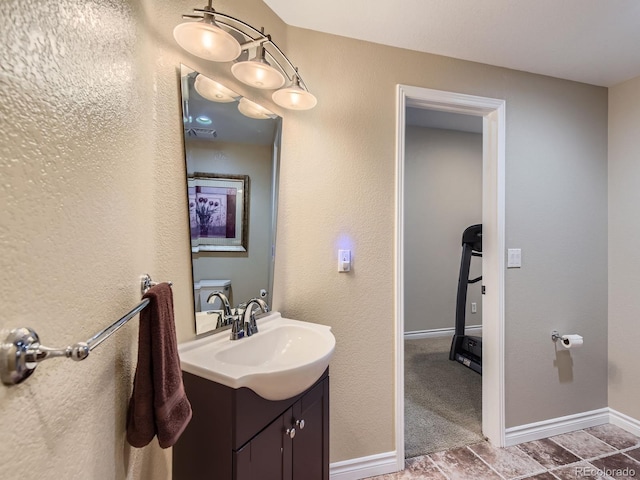 11074 Grayledge Cir, Highlands Ranch, CO 80130 - bathroom featuring vanity and baseboards