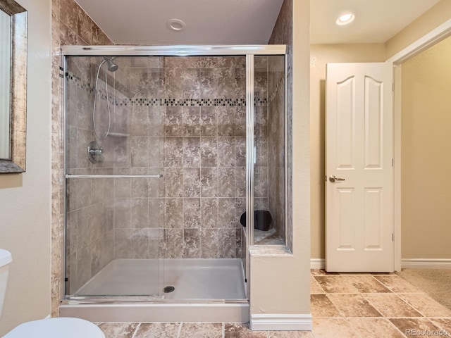 11074 Grayledge Cir, Highlands Ranch, CO 80130 - bathroom featuring a stall shower and toilet