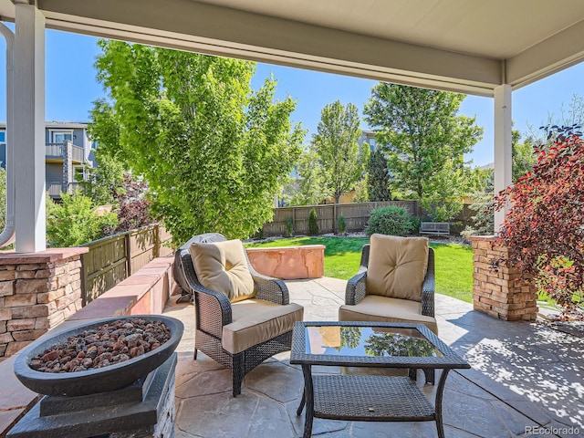 11074 Grayledge Cir, Highlands Ranch, CO 80130 - fenced backyard featuring a patio and an outdoor living space with a fire pit