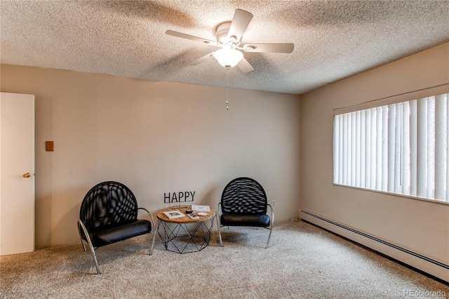 living area with carpet floors, a baseboard radiator, a textured ceiling, and a ceiling fan