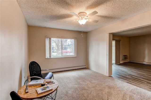 living area with a textured ceiling, a baseboard radiator, carpet flooring, and a ceiling fan