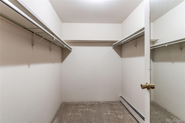 walk in closet with carpet flooring and baseboard heating