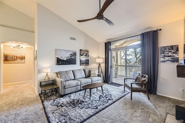 living room featuring ceiling fan, high vaulted ceiling, and carpet