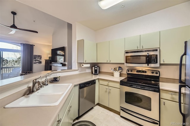 kitchen featuring sink, kitchen peninsula, ceiling fan, and appliances with stainless steel finishes