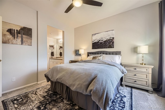 bedroom with ceiling fan, carpet floors, and ensuite bath