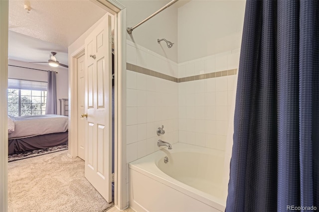 bathroom with ceiling fan, shower / tub combo with curtain, and a textured ceiling