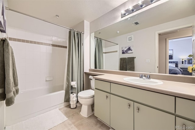 full bathroom featuring shower / tub combo with curtain, vanity, and toilet