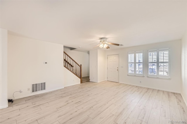 spare room with ceiling fan and light hardwood / wood-style floors