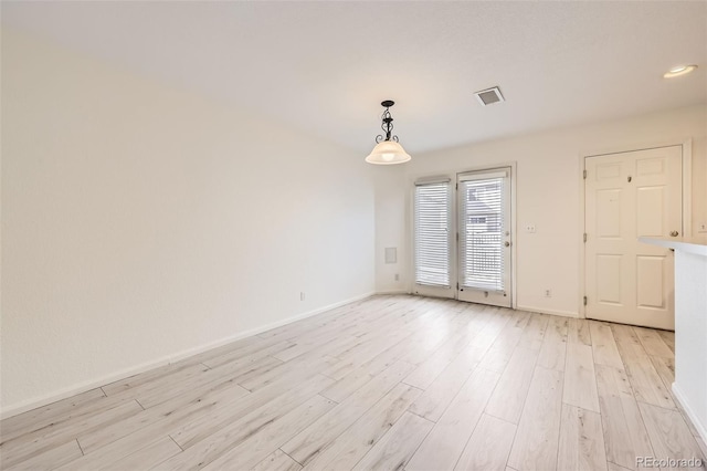 empty room featuring light hardwood / wood-style floors