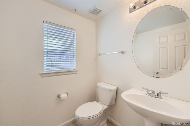 bathroom featuring sink and toilet