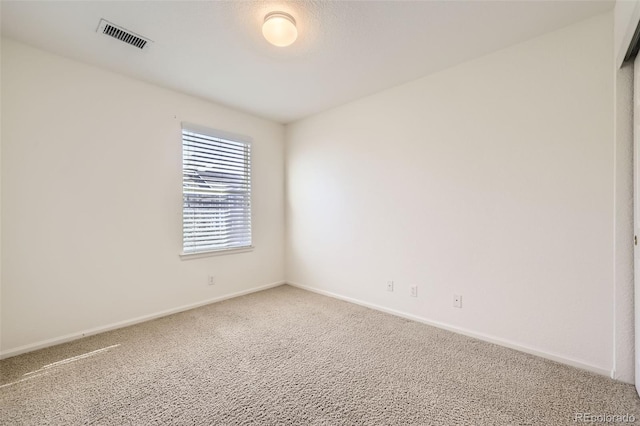 spare room with carpet floors