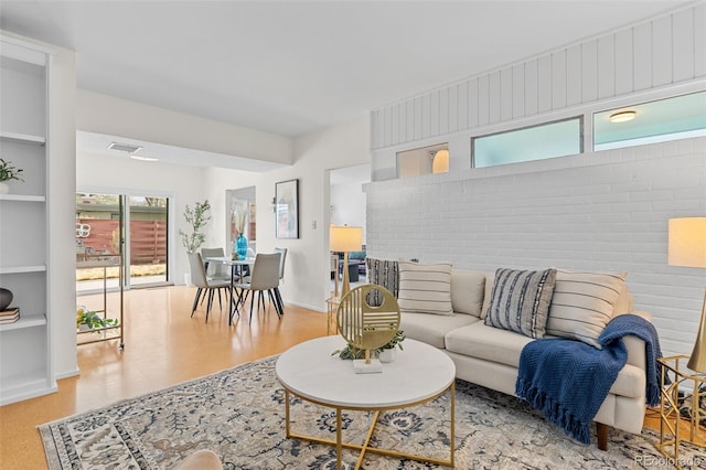 1420 E Bates Ave, Englewood, CO 80113 - living area featuring visible vents, baseboards, and wood finished floors