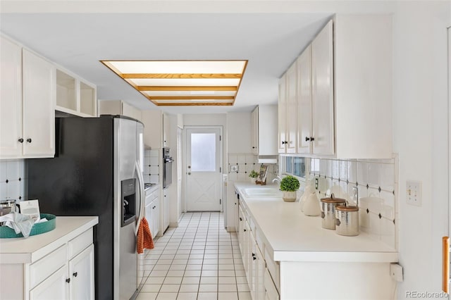 1420 E Bates Ave, Englewood, CO 80113 - kitchen featuring white cabinets, open shelves, appliances with stainless steel finishes, a sink, and light tile patterned floors