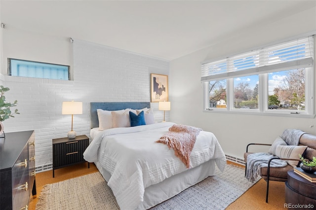 1420 E Bates Ave, Englewood, CO 80113 - bedroom featuring brick wall and baseboard heating