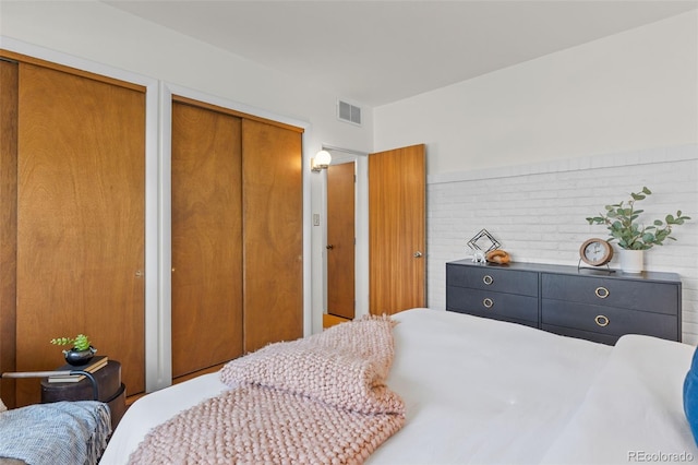 1420 E Bates Ave, Englewood, CO 80113 - bedroom featuring visible vents and multiple closets