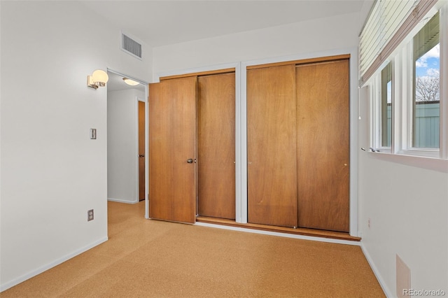 1420 E Bates Ave, Englewood, CO 80113 - unfurnished bedroom featuring two closets, baseboards, and visible vents
