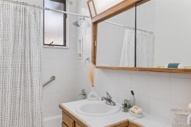 1420 E Bates Ave, Englewood, CO 80113 - bathroom with vanity, tasteful backsplash, and shower / tub combo