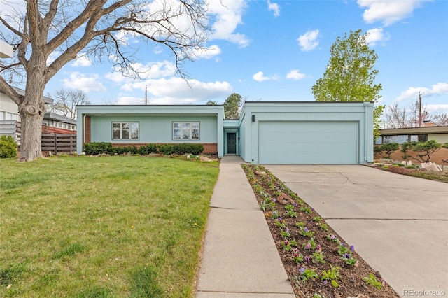 1420 E Bates Ave, Englewood, CO 80113 - view of front facade with brick siding, driveway, a front yard, and a garage